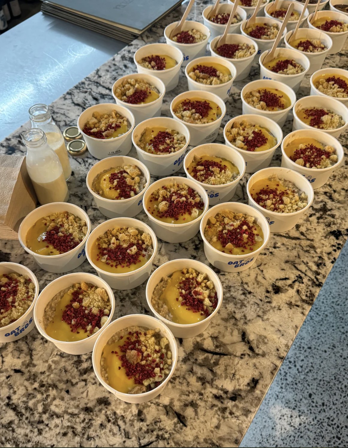 Rows of Oat Bros catering bowls, ready to serve